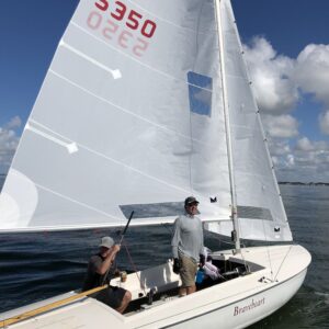 Flying Scot racing sails casual between races. Standard windows