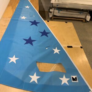 Light blue Flying Scot roller furling jib with dark blue and white stars. Light blue UV cover to match sailcloth.